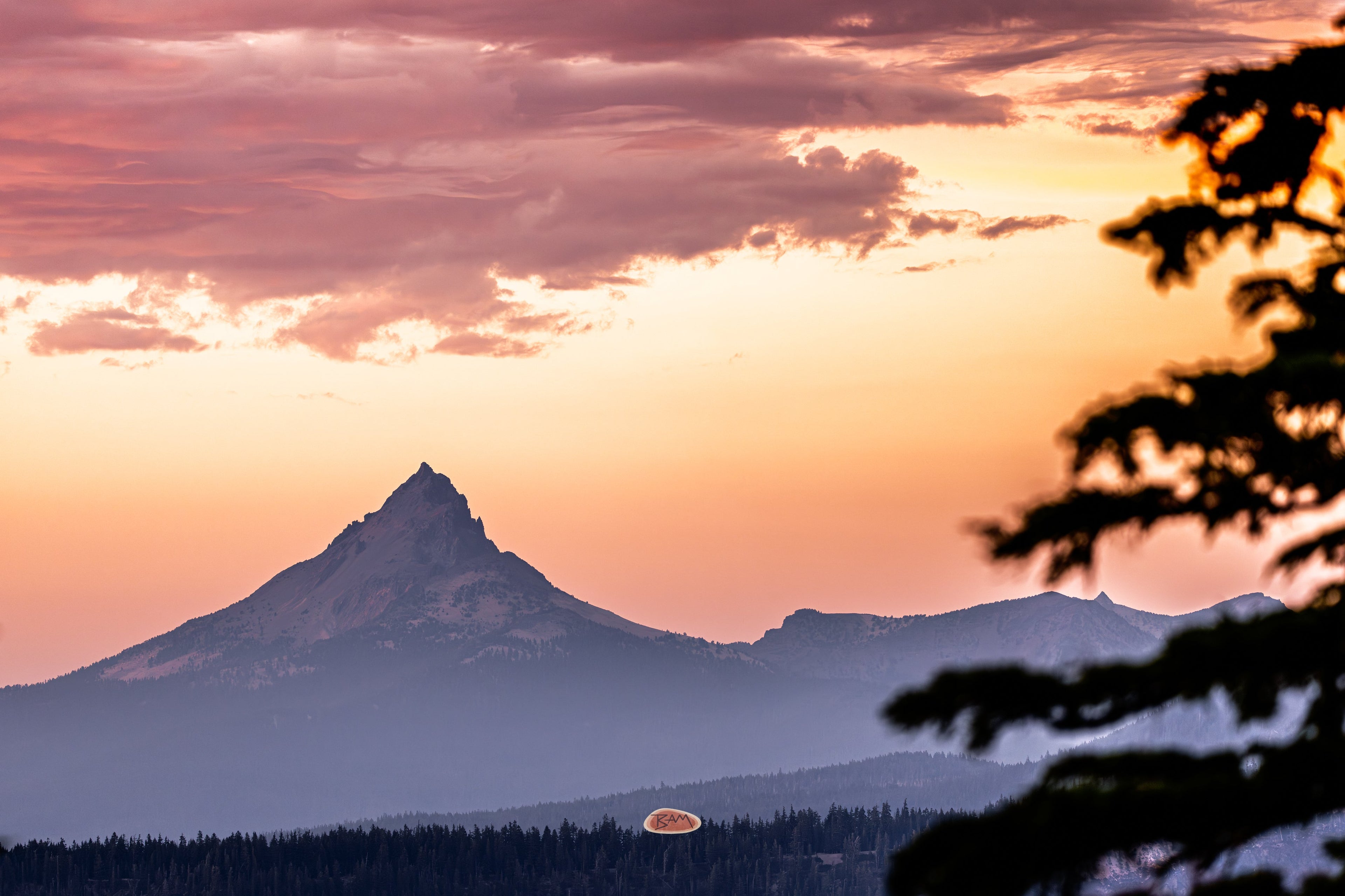 Mt Thielsen Jagged peak of Mt Thielsen against a pink and orange sunset sky