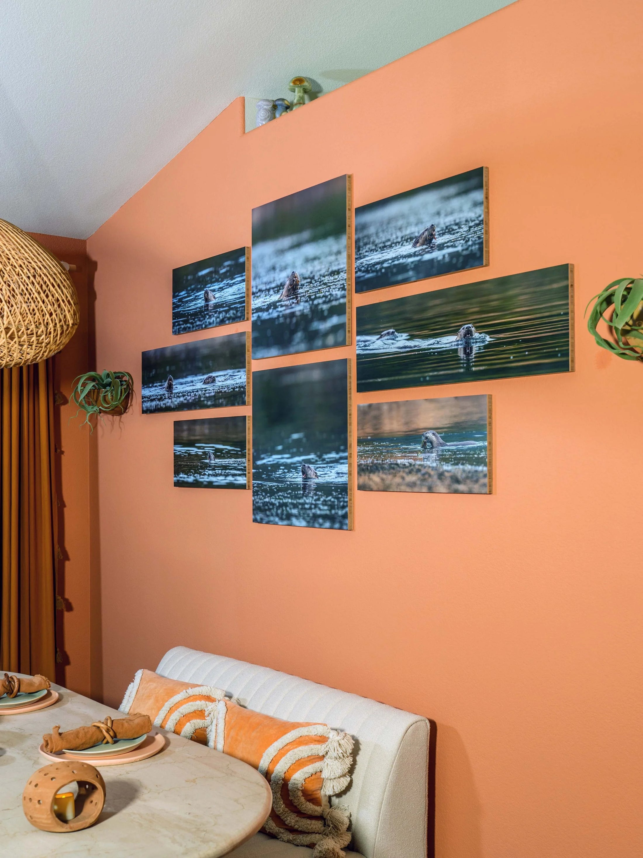 Grid of Bamboo Prints showing River Otters in water on a dining room wall